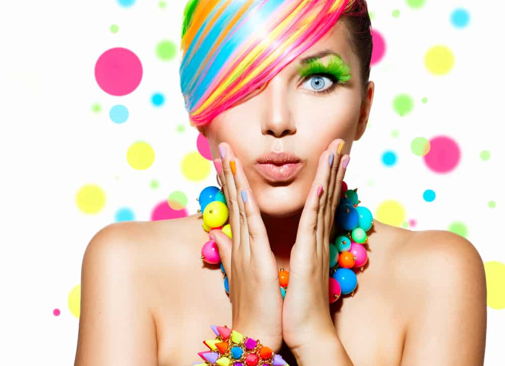 woman with colorful hair jewelry makeup