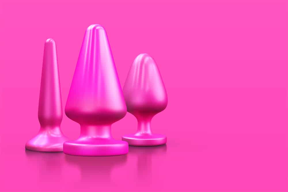 multiple pink butt plugs on pink background