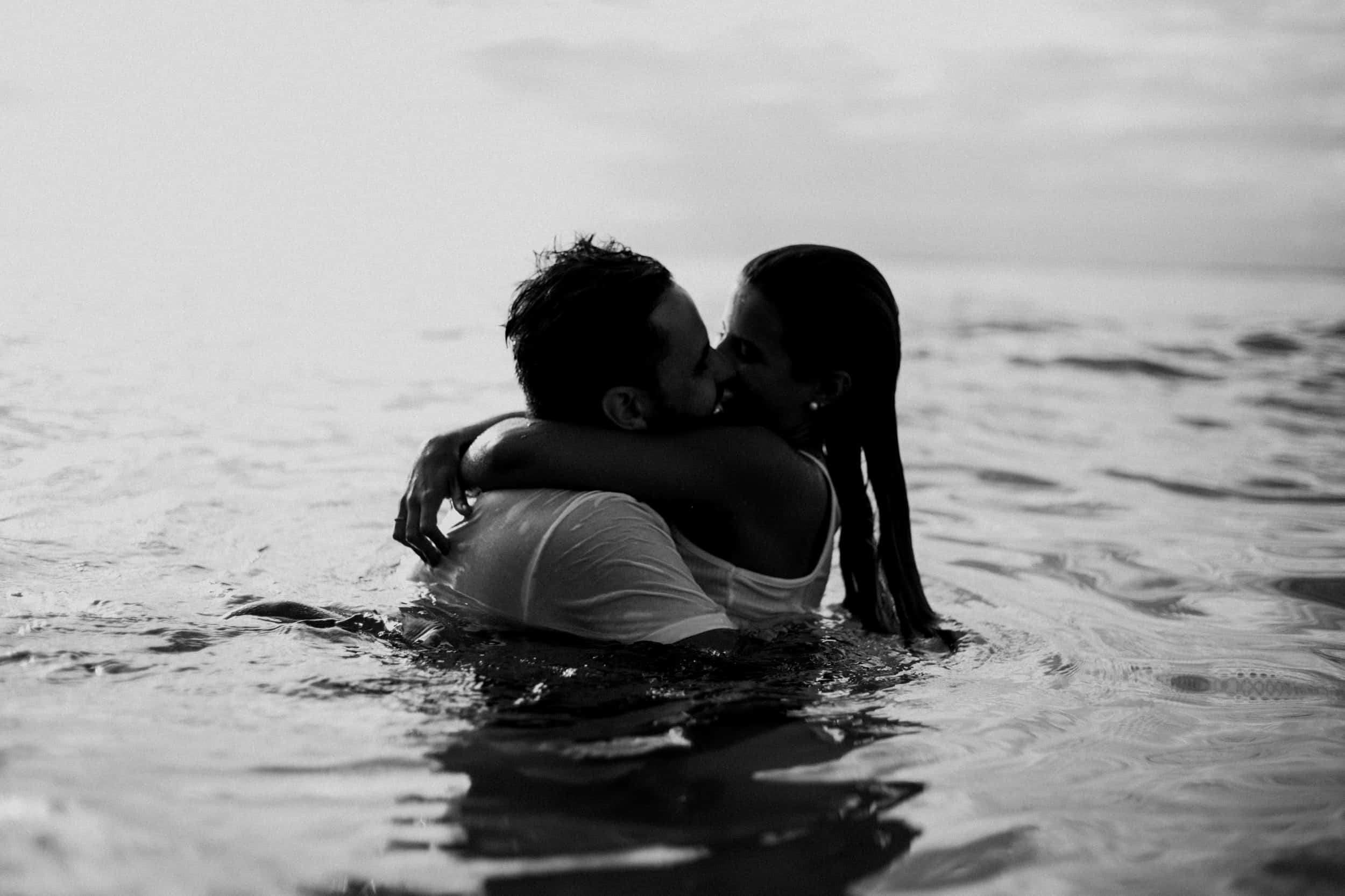 couples kissing on a beach