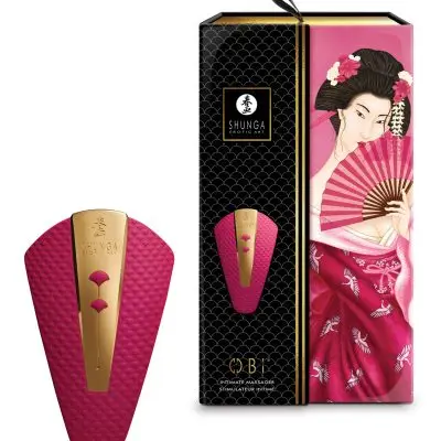 Shunga Obi sits next to the package which has a image of the toy and a woman using a hand fan