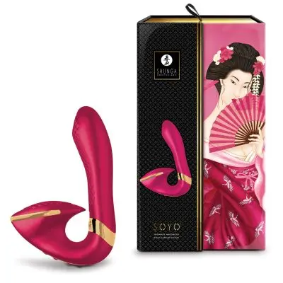 Shunga Soya sits next to the package with has a image of the toy and a woman using a hand fan