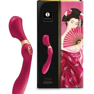 Shunga Zoa sits next to the package which has a image of the toy and a woman using a hand fan